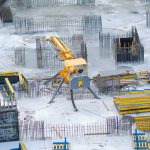 Yellow and black heavy equipment on snow covered ground